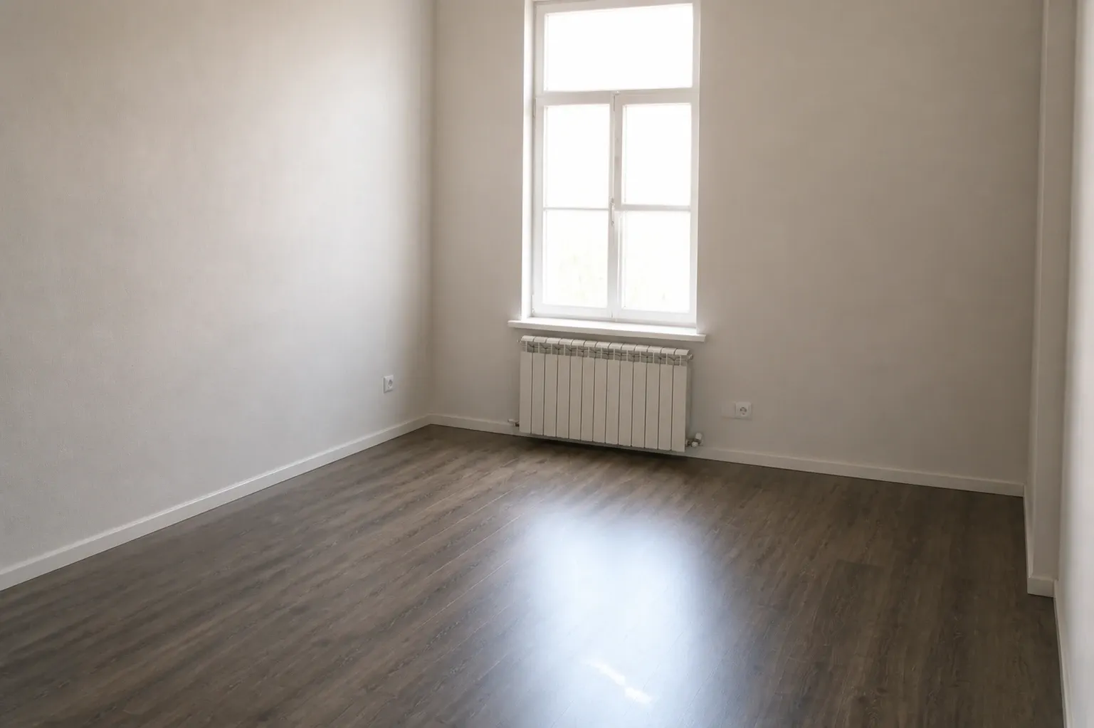 The same room cleared by AI: window, radiator and floorboards unchanged